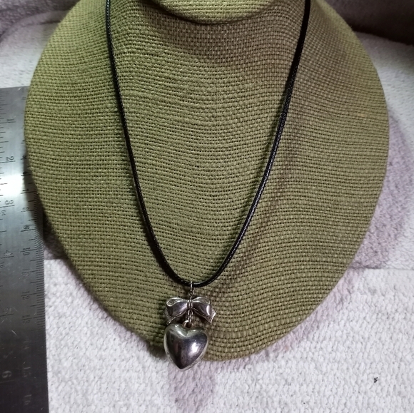 Vintage Jewelry - Silvertone heart bow pendant on black cord necklace